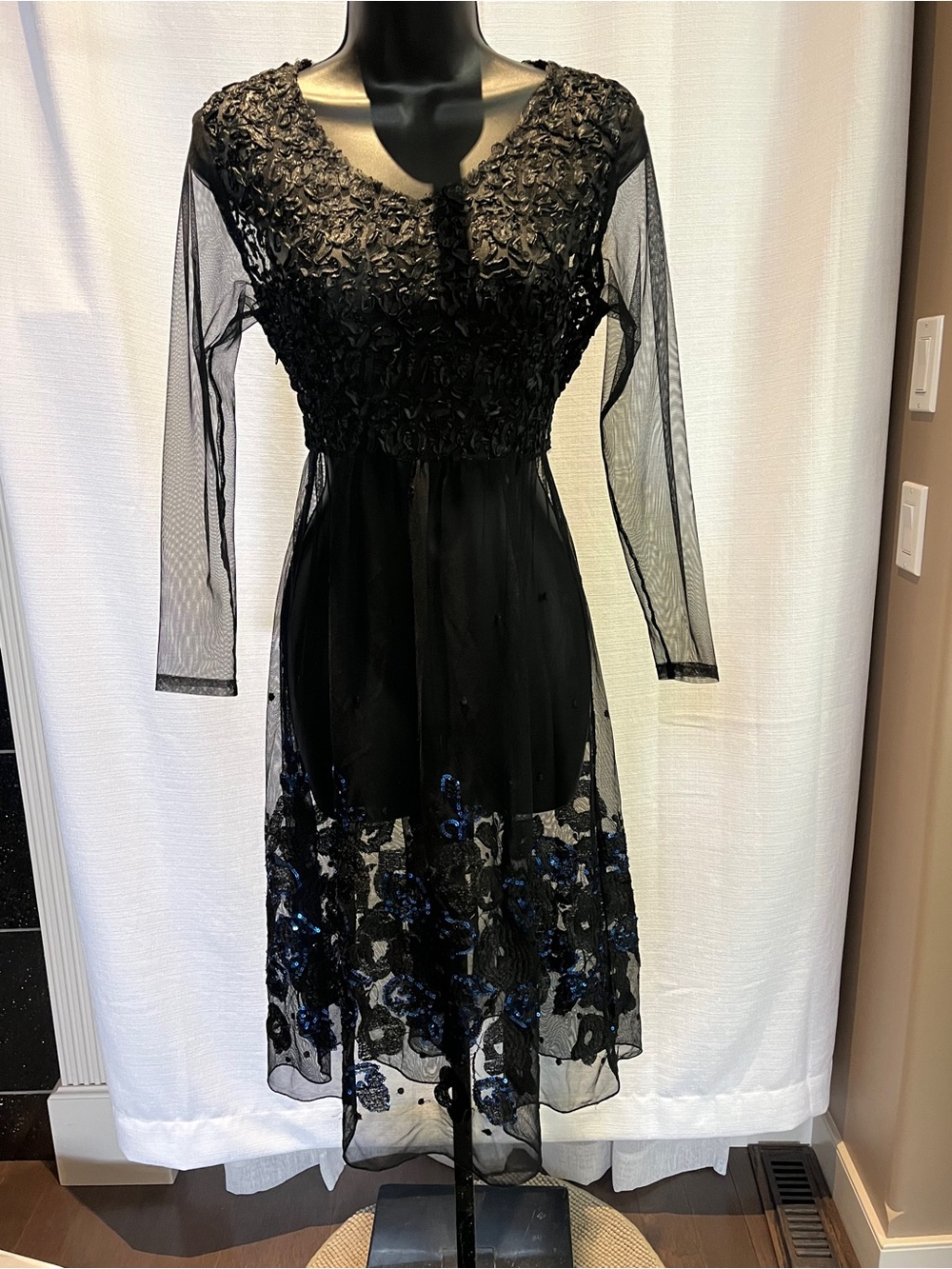 Elegant Black Midi Dress with Sheer Sleeves and Floral Sequin Hem